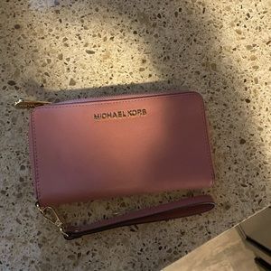 Michael Kors wristlet wallet. Never used. Paid $130 asking $90.